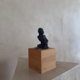 Female Figure on Wooden Plinth