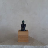 Female Figure on Wooden Plinth