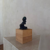 Female Figure on Wooden Plinth